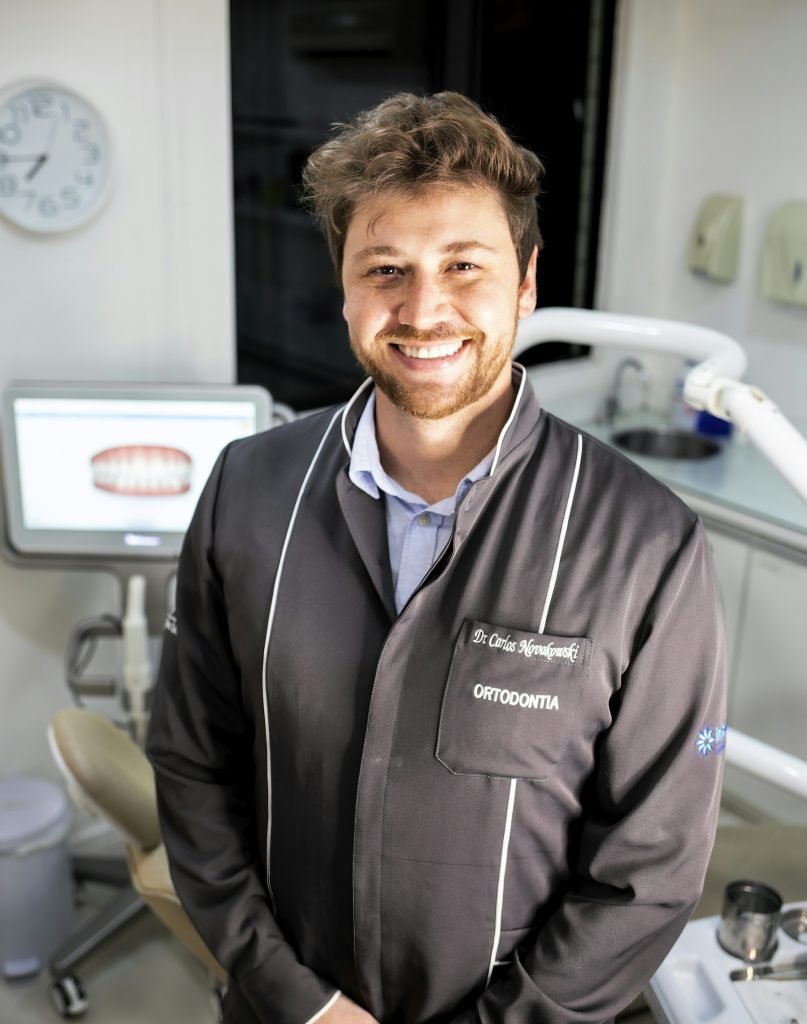 A man smiling with clean, bright teeth