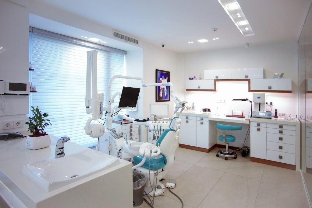 A modern dental surgery with chair and equipment
