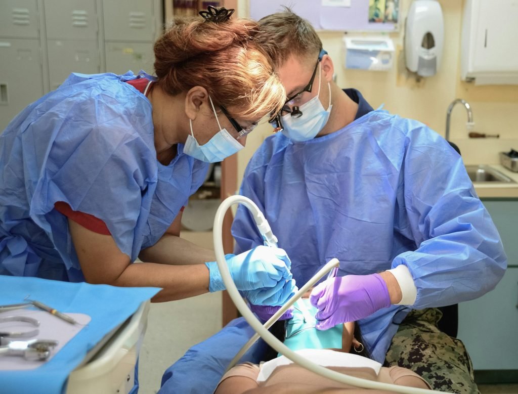 A dentist treating a patient's tooth